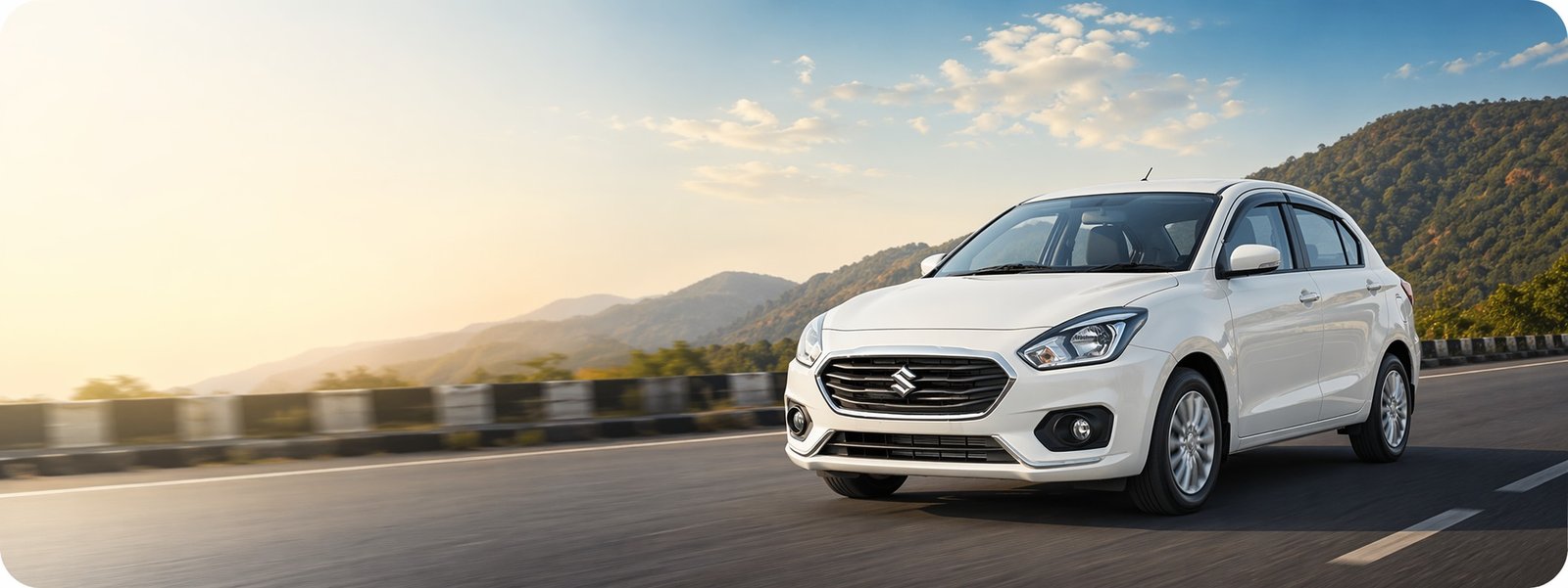 Modern white sedan on scenic highway for Srinivasa Car Travels